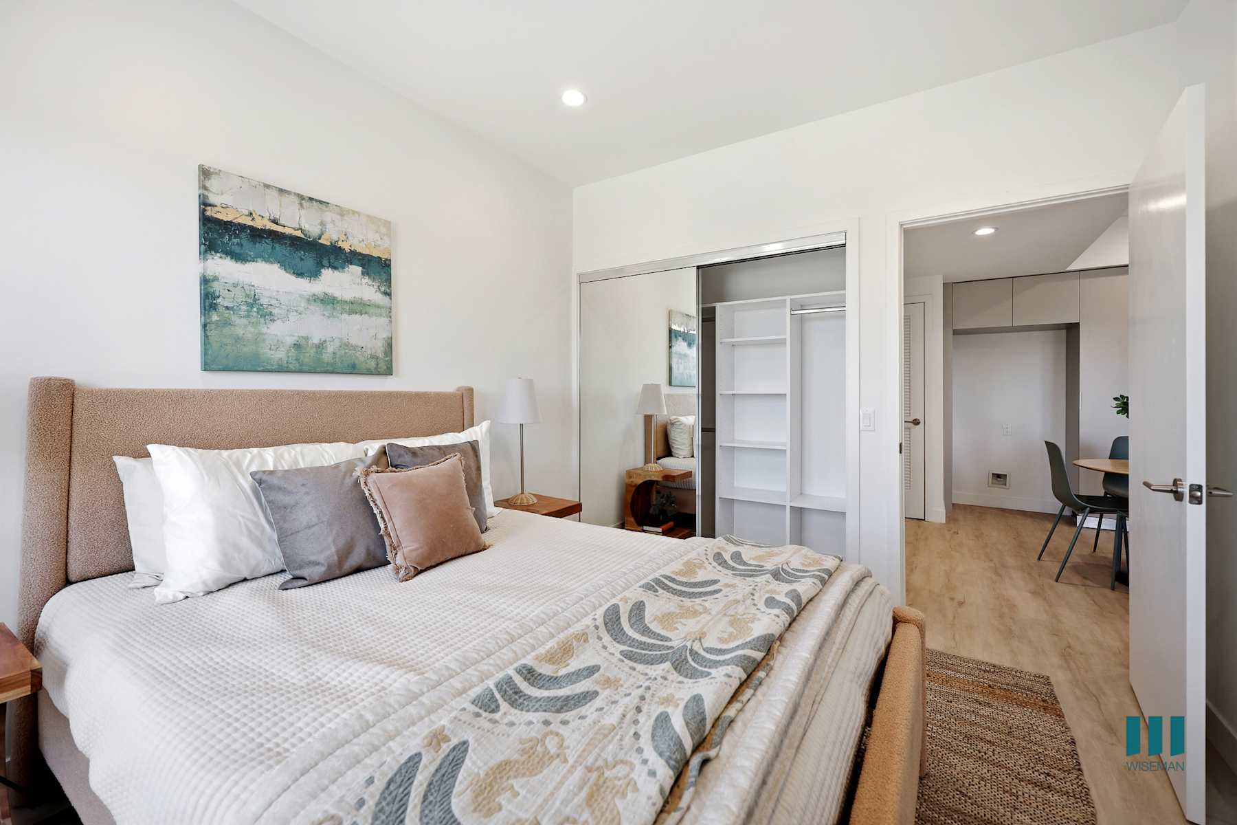Bright bedroom with fabric window shades in residence 414